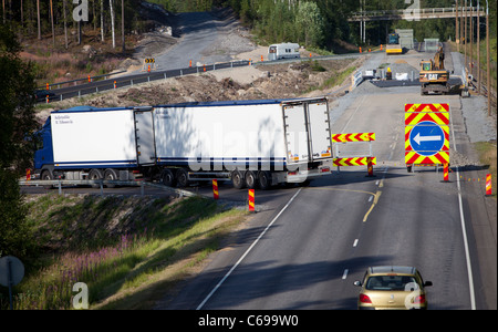 Roadworks on a highway divert traffic to a temporary road , Finland