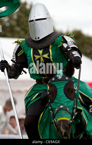 TV & film stuntman, JUSTIN PEARSON, performing with the spectacular Knights of the Damned jousting medieval display team, with galloping horses, stunts, falls, horsemanship, skilful mounted knights at Southport Flower Show, UK Stock Photo