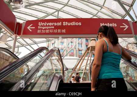 A young woman arriving at Universal studios, Sentosa island, Singapore Stock Photo
