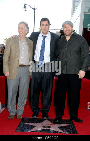 Henry Winkler, Adam Sandler, Kevin James at the induction ceremony for Star on the Hollywood Walk of Fame Ceremony for Adam Sandler, Hollywood Boulevard, Los Angeles, CA February 1, 2011. Photo By: Michael Germana/Everett Collection Stock Photo