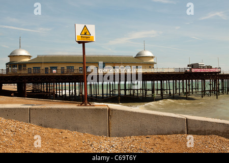 Hasting pier and beach/seafront, East Sussex, England, UK  The pier is now derelict after arson in 2010 Stock Photo