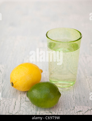 Glass of sparkling water with lemon and lime Stock Photo