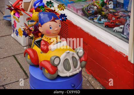 Noddy in his car outside a toyshop in the High Street, Lymington, Hampshire, England, UK. Stock Photo