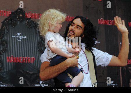 Russell Brand holding Felicitas, a photographer's daughter, at a photocall for the movie 'Get Him To The Greek' ('Maennertrip') Stock Photo