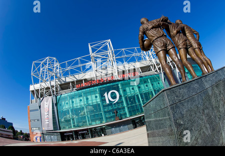 Main entrance of Manchester United FC's ground at Old Trafford in Manchester showing the 'Holy Trinity' statue