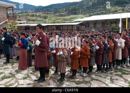 Morning prayer in Ura boarding school courtyard. Bhutan Stock Photo