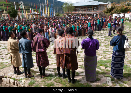 Morning prayer in Ura boarding school courtyard. Bhutan Stock Photo