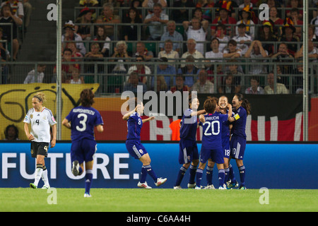 Japan players celebrate after a goal by Karina Maruyama (18) that defeated Germany in 2011 Women's World Cup quarterfinal match. Stock Photo