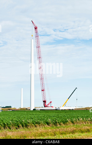 Components for a horizontal-axis wind turbine are being assembled on a construction site near Lakefield, Minnesota. Stock Photo