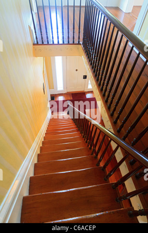 staircase leading from second floor at the Orman House, an historic southern mansion that is now a state park, Apalachicola, FL Stock Photo