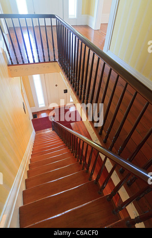 staircase leading from second floor at the Orman House, an historic southern mansion that is now a state park, Apalachicola, FL Stock Photo