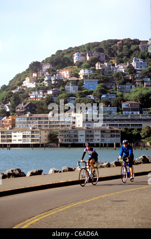 two bicyclists ride into the Hurrican Gulch section of Sausalito Stock Photo