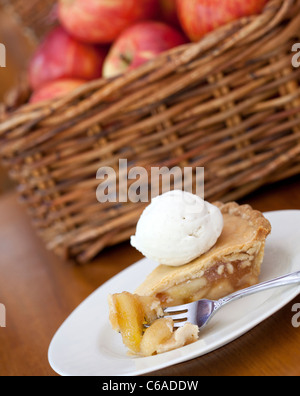 Apple pie ala mode on a wooden table