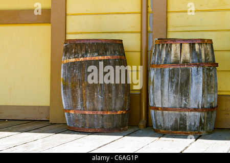 Old oak barrels on railroad platform. Stock Photo