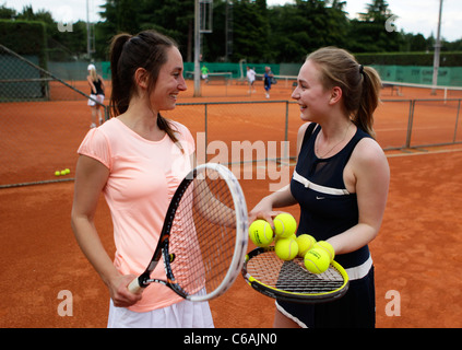 Two young women are having a chat at a tenniscamp in Umag,Croatia Stock Photo