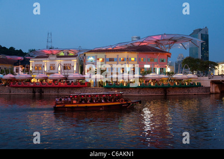 Clarke quay and the Singapore river at dusk seen from Riverside point, Singapore Stock Photo