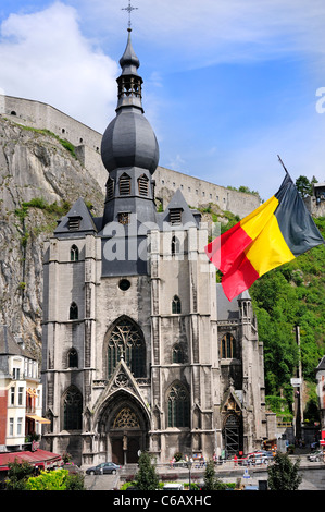 Dinant, Belgium. Eglise Notre-Dame. Originally built 1240 - rebuilt several times since after damage. Belgian Flag Stock Photo