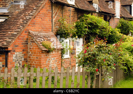 a wooden fence surrounding a front garden in Turville village Bucks UK Stock Photo