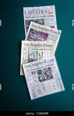 Headlines from the Los Angeles Times in early August 2011 describe a deepening worldwide financial crisis. Stock Photo