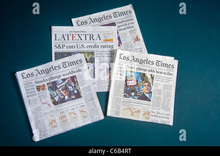 Headlines from the Los Angeles Times in early August 2011 describe a deepening worldwide financial crisis. Stock Photo