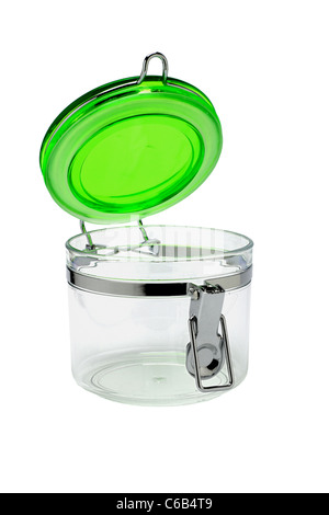 Open glass container with green plastic lid on white background Stock Photo