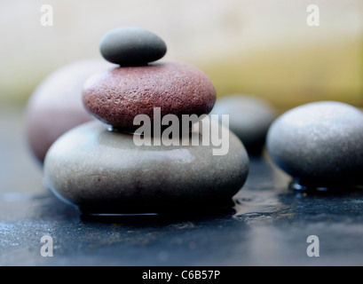 several rounded beach pebbles stacked in size Stock Photo