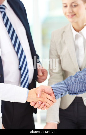 Photo of handshake of business partners after signing contract Stock Photo