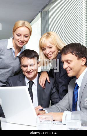 Four business people working in office Stock Photo