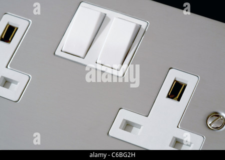Close up of brushed steel, electrical socket. Stock Photo