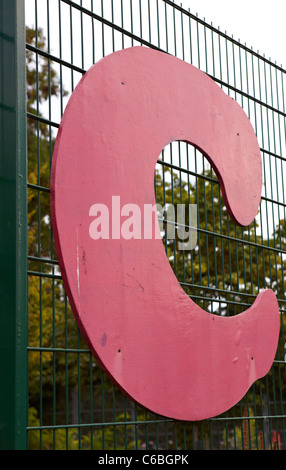 letter C sign on fence Stock Photo