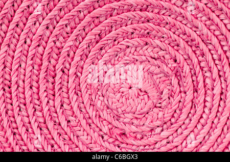 Circular background from pink rattan fibers. Stock Photo