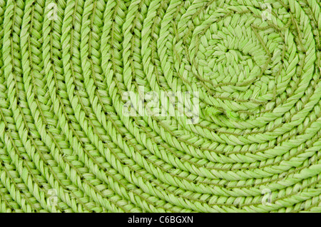 Circular background from green rattan fibers. Stock Photo