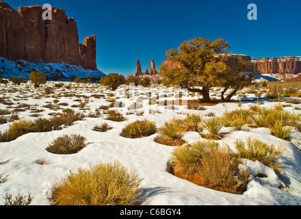 Monument Valley is a region of the Colorado Plateau characterized by a cluster of vast and iconic sandstone buttes. Stock Photo