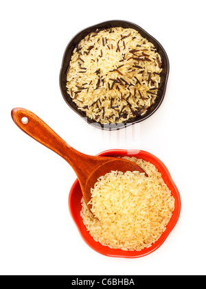 two bowls with rice and wooden spoon Stock Photo