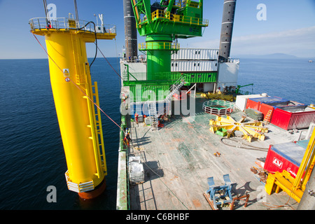 The jack up barge, The Goliath lifting a 320 tonne transition piece into place on the Walney Offshore windfarm project, Stock Photo