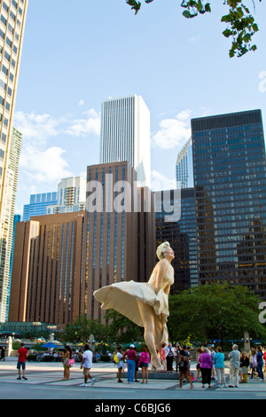 Marilyn Monroe statue surrounded by tourists on Michigan Avenue in downtown Chicago, Illinois. Stock Photo