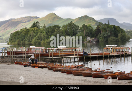 Wooden rowing and pleasure boats on Derwent water, Keswick, Catbells fell in the background, Cumbria, England, UK Stock Photo