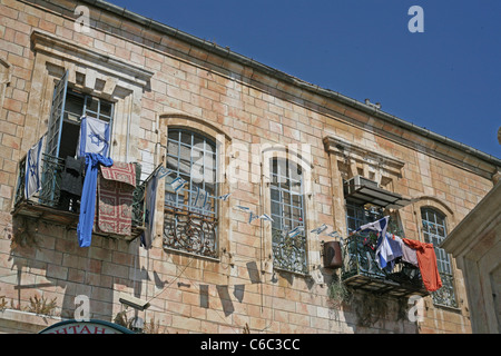 Washing hanging from a window in old city, Jerusalem, Israel, Palestine. Stock Photo