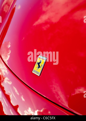 Bonnet of bright red Ferrari sports car with the company logo visible Stock Photo