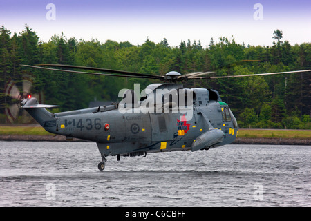 A specially adapted Sea King helicopter of the Canadians Marines gives a water birding demonstration landing on water Stock Photo