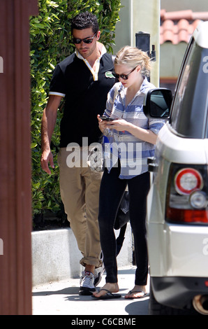 Amanda Seyfried and her boyfriend Dominic Cooper leaving a personal trainers house in West Hollywood. Los Angeles, California - Stock Photo