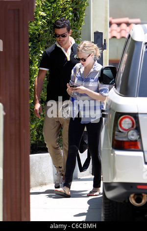 Amanda Seyfried and her boyfriend Dominic Cooper leaving a personal trainers house in West Hollywood. Los Angeles, California - Stock Photo