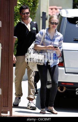 Amanda Seyfried and her boyfriend Dominic Cooper leaving a personal trainers house in West Hollywood. Los Angeles, California - Stock Photo