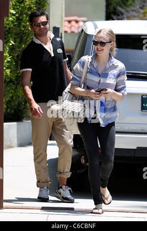 Amanda Seyfried and her boyfriend Dominic Cooper leaving a personal trainers house in West Hollywood. Los Angeles, California - Stock Photo