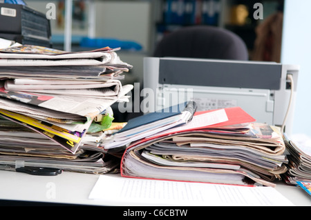 Heap of newspapers and the disorder on a table Stock Photo