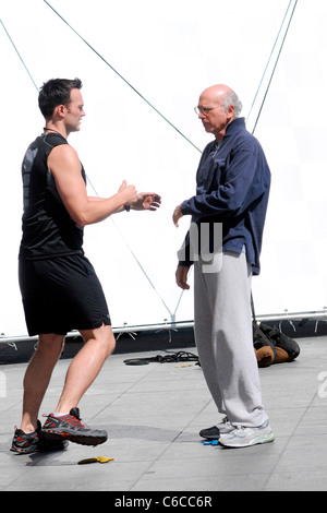 Cheyenne Jackson and Larry David filming a scene for HBO's 'Curb Your Enthusiasm' on location in Manhattan New York City, USA - Stock Photo