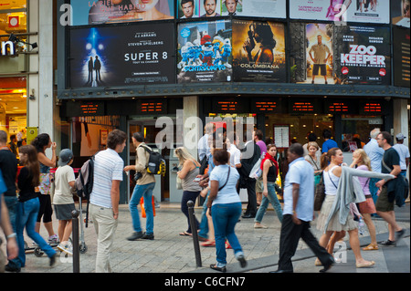 Paris, France, Front French teenagers outside cinema, Movie Theatre Marquee, Gaumont, Large Crowd  people walking on Busy Street, the champs elysees, Looking cinema posters, front Stock Photo