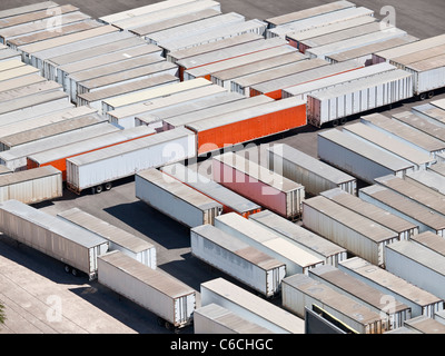 Dozens of idle truck trailers in bright desert light. Stock Photo