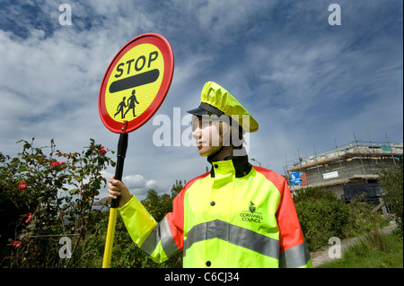 Cornwall's youngest lollipop lady in 2011, 18 year old Tomasina on school crossing patrol. Stock Photo