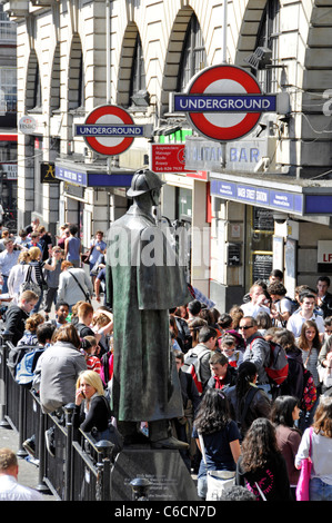 London street scene view from above looking down on bronze statue of Sherlock Holmes & crowd of people outside Baker Street Underground tube station Stock Photo